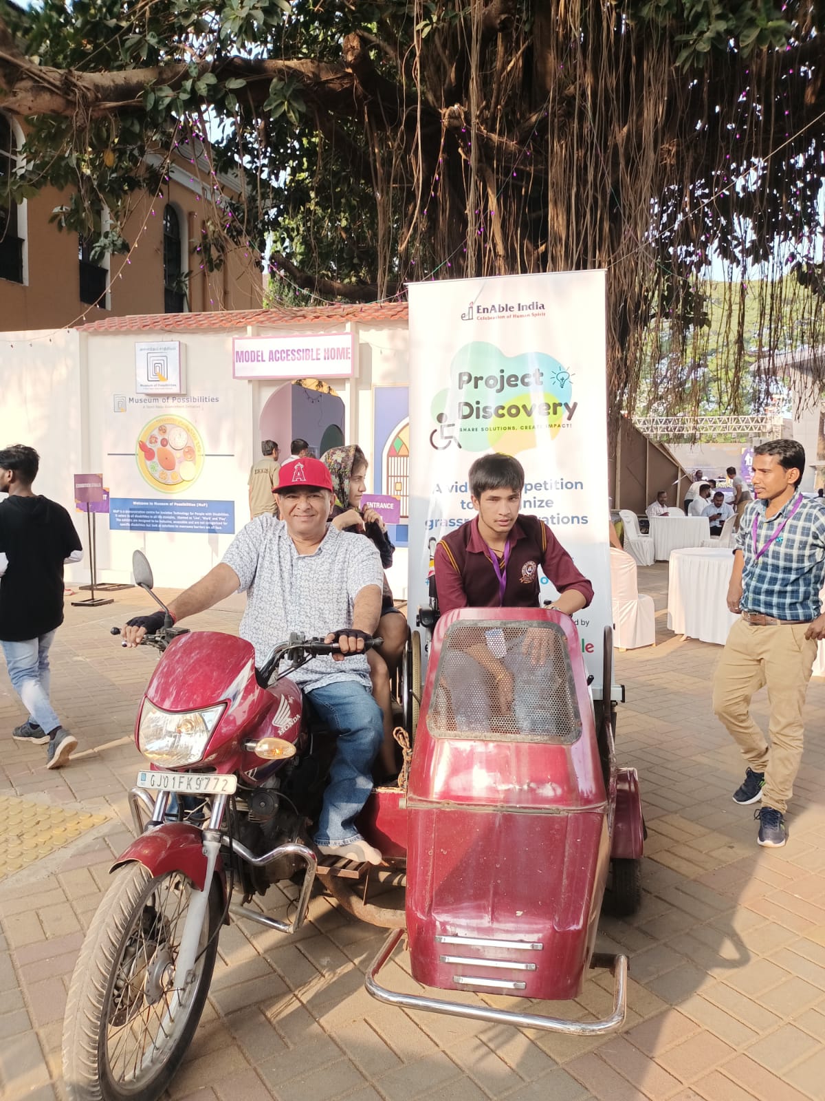 Two men showcasing an innovative assistive sidecar solution at Project Discovery event.